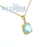 14 Karat Yellow Gold Pendant with a Blue Topaz and a 0.02 Carat Round
